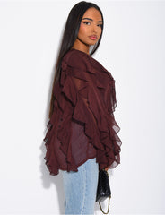 Blouse en voile transparent à volants